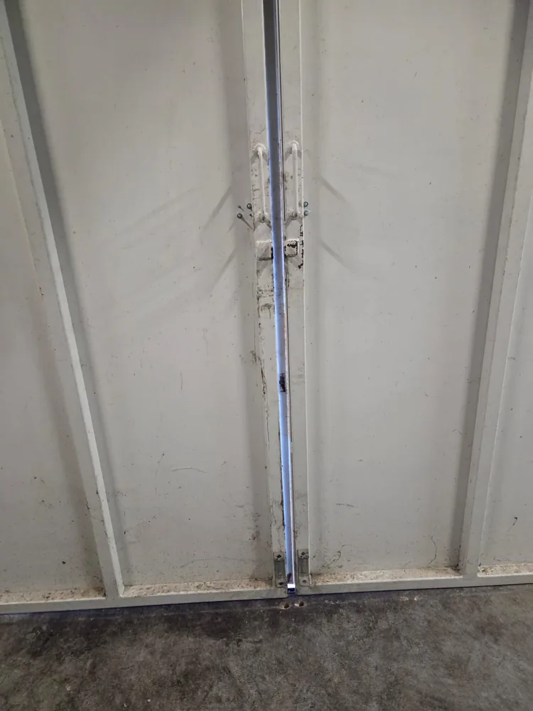 Inside face of the bin store doors after the internal locking pins were removed