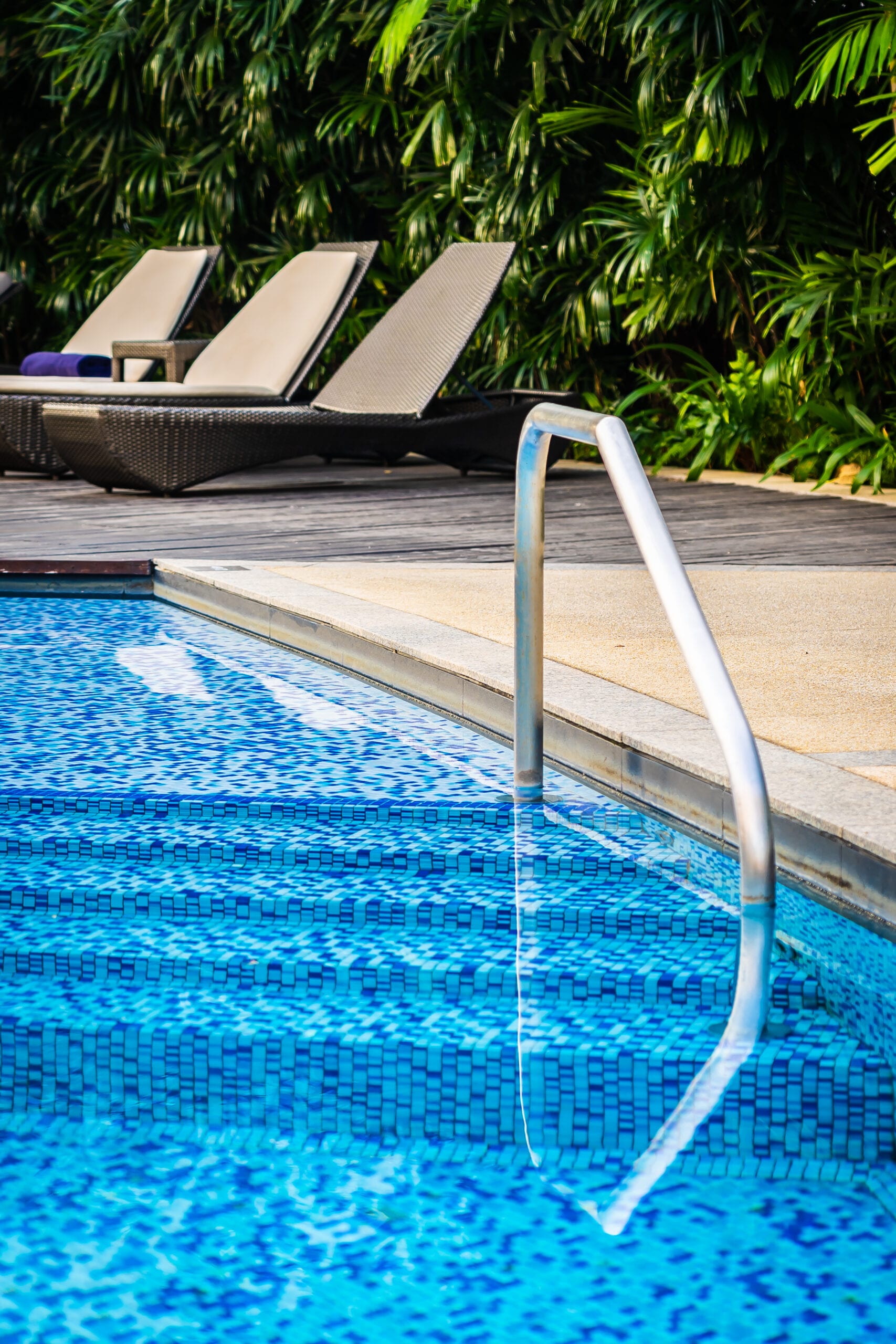 Well-maintained residential pool at dusk, serviced regularly under Cameron Facilities’ reliable pool services.