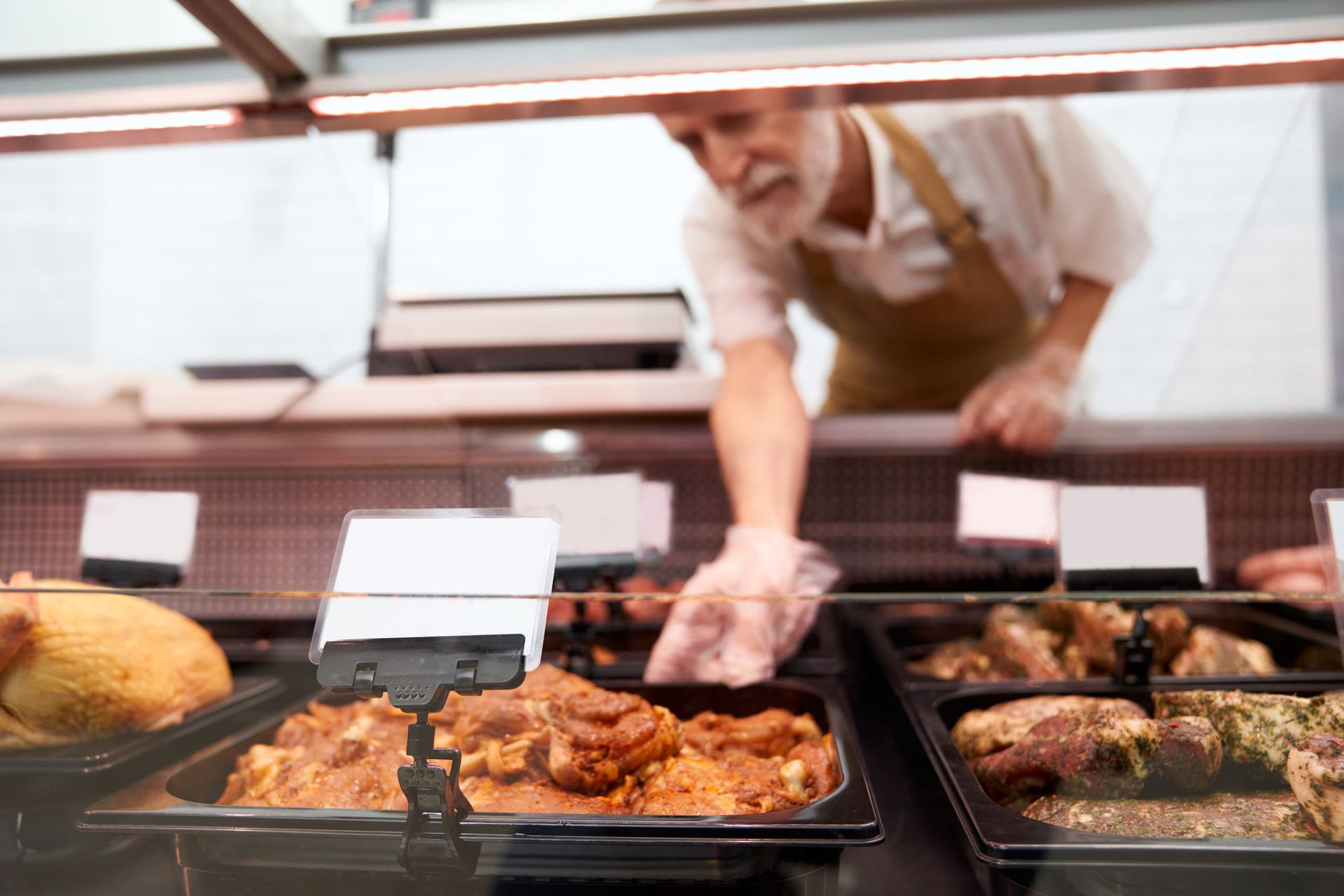 Food handler following hygiene practice while preparing ingredients