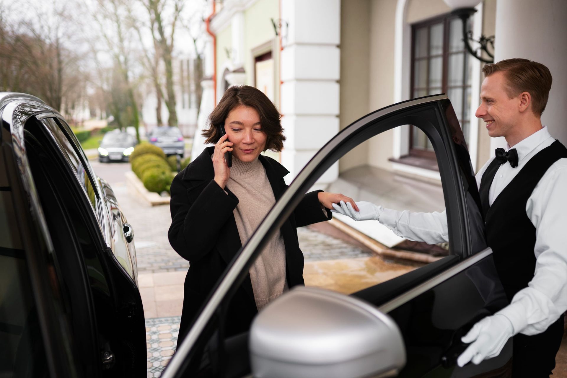 Valet attendant coordinating vehicle parking at a Perth building entrance