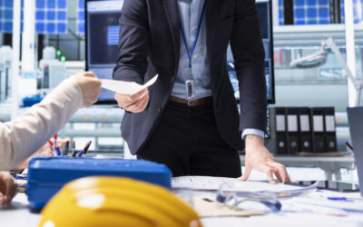Integrated facilities management team conducting building inspection with digital tablet and IoT sensors in modern commercial office