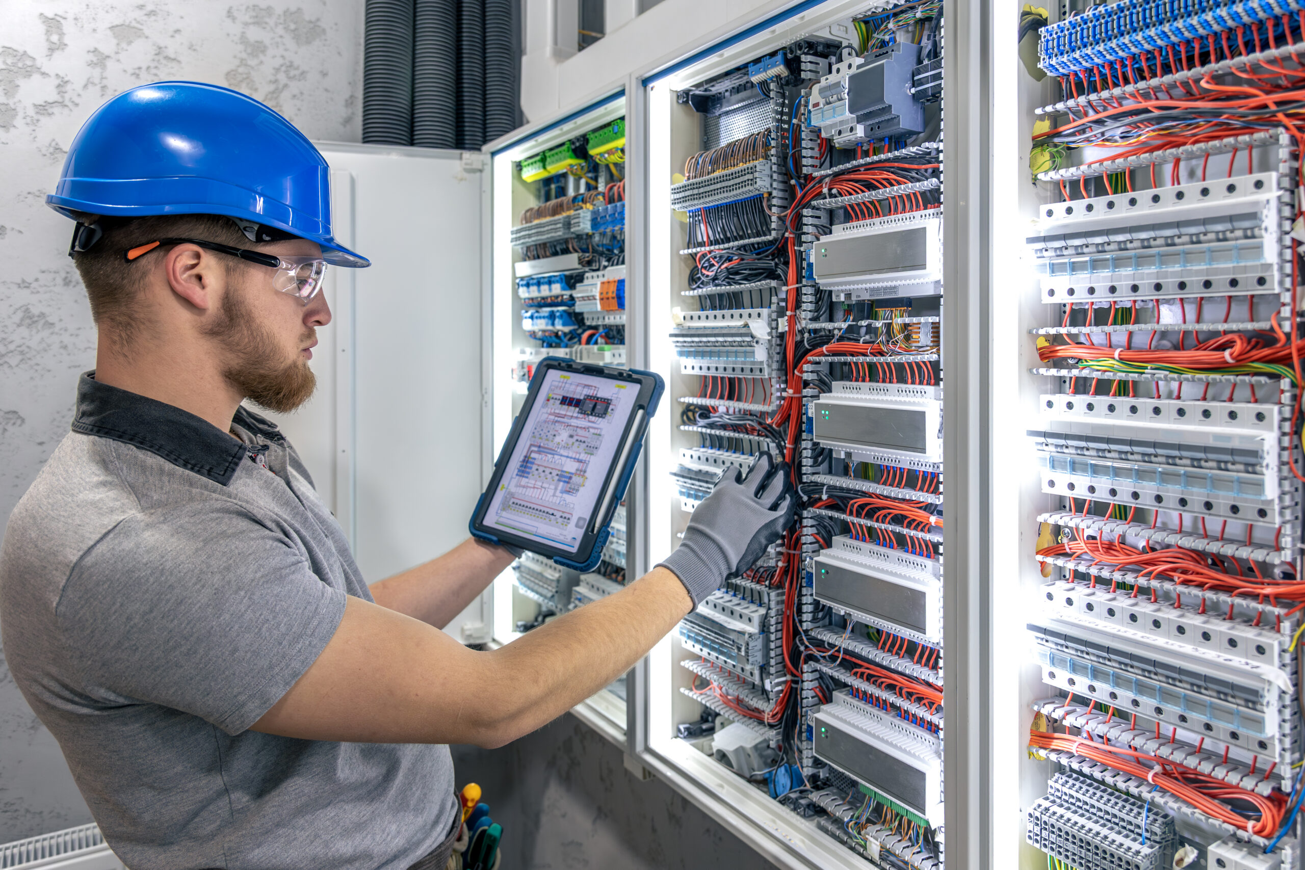 Building systems technician testing electronic access control equipment