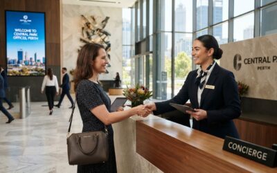 Professional concierge greeting visitor in Perth commercial office building lobby